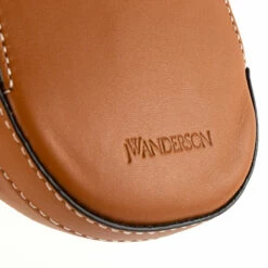 JW Anderson Nano Leather Cap Bag Pecan In Pecan -Hervia Shop hervia.com hb0232 la0020 623 nano cap bag pecan 16298886843WEDFCDXSA 0000 Layer 10