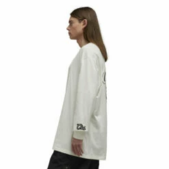 Y-3 Graphic Long Sleeve Tee In Off White 6 Y-3 Graphic Long Sleeve Tee In Off White -Hervia Shop hervia.com y 3 graphic long sleeve tee 1696326251IQ2147 6 APPAREL On Model Side View white