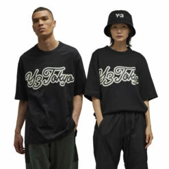 Y-3 Graphic Short Sleeve T-Shirt In Black -Hervia Shop hervia.com y 3 iq2140 gfx yy ss tee col. black 1695914190IQ2140 12 APPAREL On Model Standard Unisex Pair Shot white